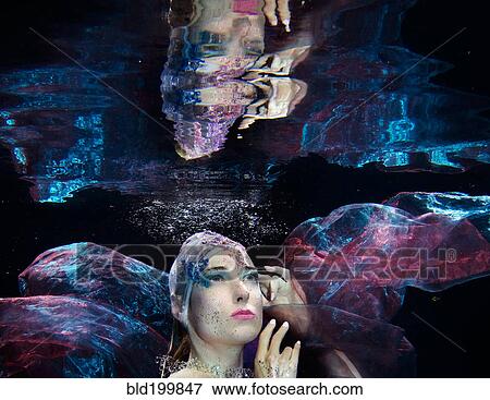 Stock Photo - Caucasian woman under water. Fotosearch