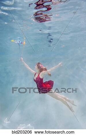 Caucasian woman with balloons underwater View Large Photo Image Stock Photograph - Caucasian woman with balloons underwater. Fotosearch