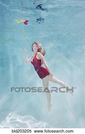 Caucasian woman with balloons underwater View Large Photo Image Stock Photography - Caucasian woman with balloons underwater. Fotosearch