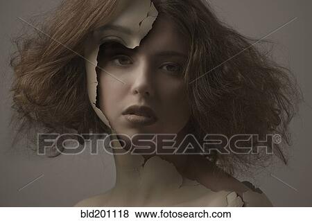 Stock Photo - Caucasian woman with broken plastic skin. Fotosearch