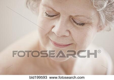 Stock Image - Caucasian woman with eyes closed. Fotosearch