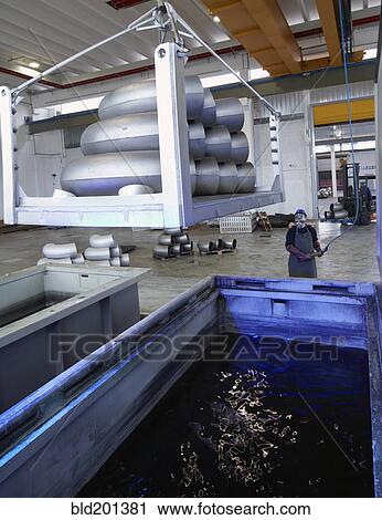 Caucasian worker working in steel factory View Large Photo Image Stock Image - Caucasian worker working in steel factory. Fotosearch