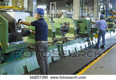 Caucasian workers working in steel factory View Large Photo Image Stock Image - Caucasian workers working in steel factory. Fotosearch