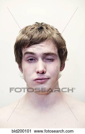 Stock Image - Caucasian young man crying. Fotosearch