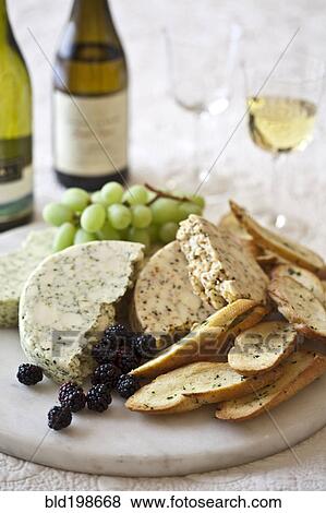 Cheese, berries and bread on cutting board View Large Photo Image Stock Photo - Cheese, berries and bread on cutting board. Fotosearch