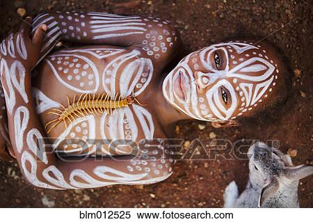 Child laying on ground painted with traditional markings View Large Photo Image Stock Photography - Child laying on ground painted with traditional markings. Fotosearch