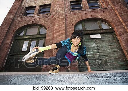 Chinese woman breakdancing in urban area View Large Photo Image Stock Image - Chinese woman breakdancing in urban area. Fotosearch