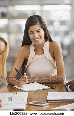 Stock Image - Chinese woman studying. Fotosearch
