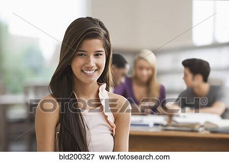 Stock Photo - Chinese woman studying with friends. Fotosearch
