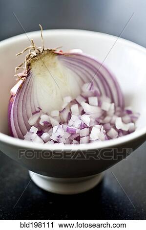 Stock Image - Chopped red onion in bowl. Fotosearch