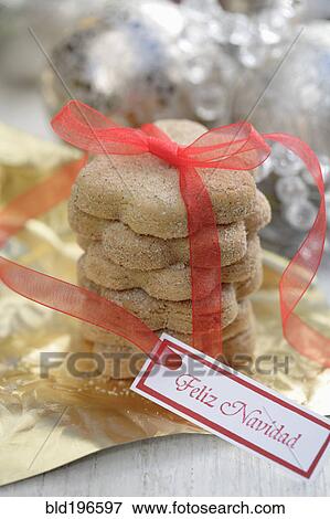 Stock Photo - Christmas cookies tied with red ribbon. Fotosearch