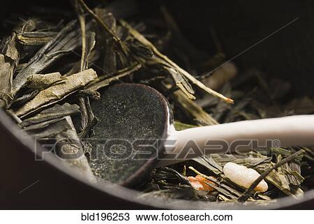 Stock Image - Close up of bowl, spoon and organic food. Fotosearch