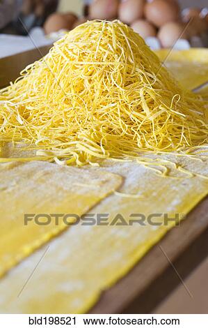 Stock Image - Close up of fresh pasta noodles. Fotosearch