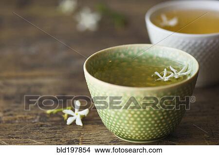 Picture - Close up of jasmine tea in teacup. Fotosearch