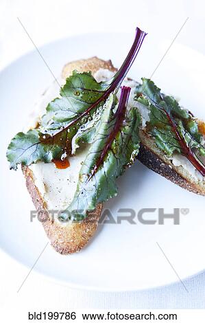 Stock Photograph - Close up of lettuce on toast. Fotosearch