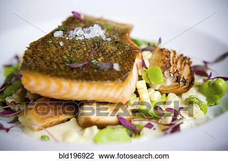Stock Image - Close up of salmon entree on plate. Fotosearch