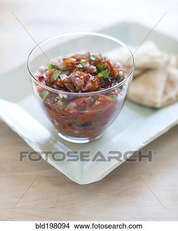 Picture - Close up of salsa and bread. Fotosearch