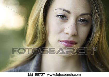 Stock Photo - Close up of serious Hispanic woman. Fotosearch