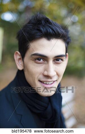 Stock Photo - Close up of smiling mixed race man. Fotosearch