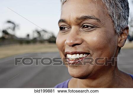Close up of smiling woman View Large Photo Image Stock Image - Close up of smiling woman. Fotosearch