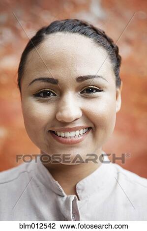 Stock Image - Close up of smiling woman. Fotosearch