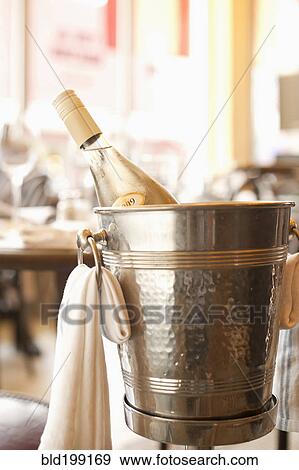 Stock Photo - Close up of white wine in ice bucket. Fotosearch