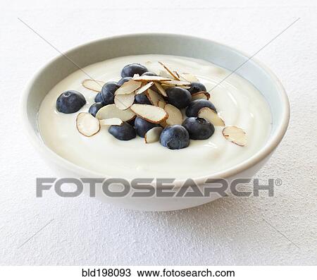 Close up of yogurt, fruit and nuts in bowl View Large Photo Image Stock Image - Close up of yogurt, fruit and nuts in bowl. Fotosearch