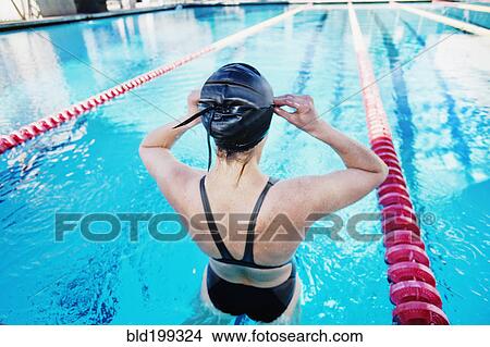 Competitive swimmer in swimming pool View Large Photo Image Picture - Competitive swimmer in swimming pool. Fotosearch