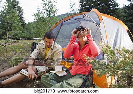 Couple camping together View Large Photo Image Stock Image - Couple camping together. Fotosearch