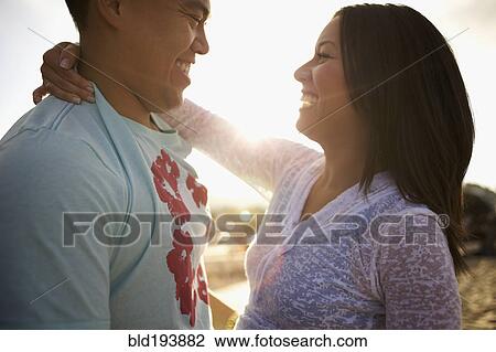 Couple hugging outdoors View Large Photo Image Stock Image - Couple hugging outdoors. Fotosearch