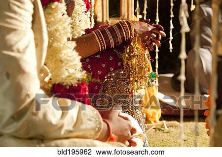 Couple in ornate, traditional Indian wedding clothing View Large Photo Image Stock Image - Couple in ornate, traditional Indian wedding clothing. Fotosearch