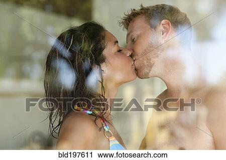 Couple kissing behind window View Large Photo Image Stock Image - Couple kissing behind window. Fotosearch