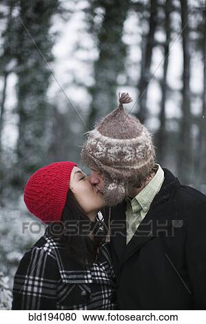 Couple kissing outdoors View Large Photo Image Stock Image - Couple kissing outdoors. Fotosearch