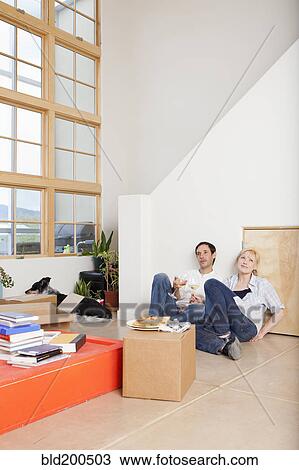 Couple moving into new house View Large Photo Image Stock Image - Couple moving into new house. Fotosearch