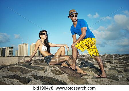Stock Photo - Couple on beach together. Fotosearch