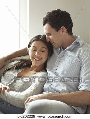Stock Photo - Couple relaxing together. Fotosearch
