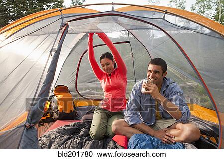 Couple sitting in tent View Large Photo Image Stock Image - Couple sitting in tent. Fotosearch