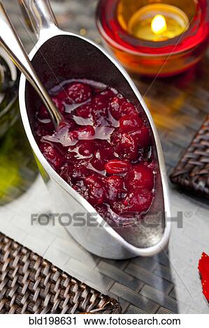 Cranberry sauce in pitcher on table View Large Photo Image Stock Image - Cranberry sauce in pitcher on table. Fotosearch