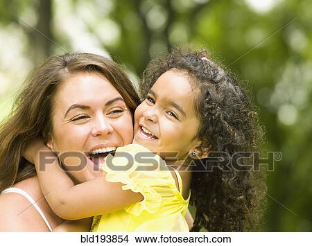 Daughter hugging mother View Large Photo Image Picture - Daughter hugging mother. Fotosearch