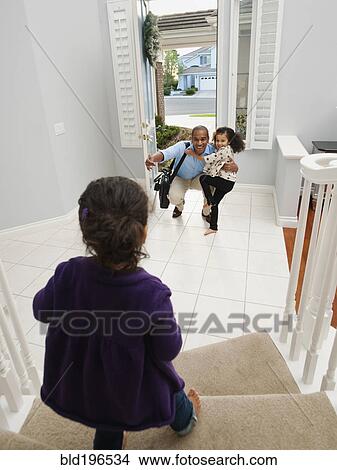 Daughters greeting returning father View Large Photo Image Picture - Daughters greeting returning father. Fotosearch