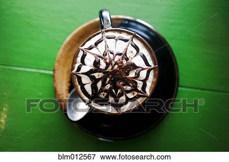 Decorative design in foam on latte View Large Photo Image Stock Photo - Decorative design in foam on latte. Fotosearch
