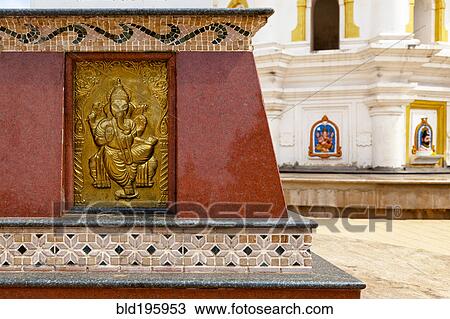 Stock Image - Detail on wall of the Shri Mahalsa Temple. Fotosearch