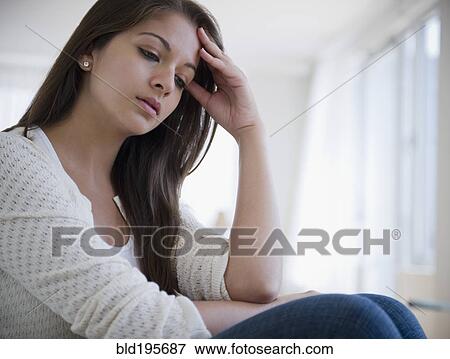 Disappointed Indian woman with head in hands View Large Photo Image Stock Photo - Disappointed Indian woman with head in hands. Fotosearch