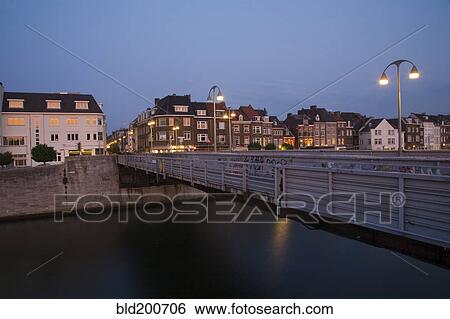 Stock Photograph - Dutch canal and bridge at night. Fotosearch