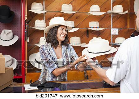 Ecuadorian woman working in hat store View Large Photo Image Stock Photo - Ecuadorian woman working in hat store. Fotosearch