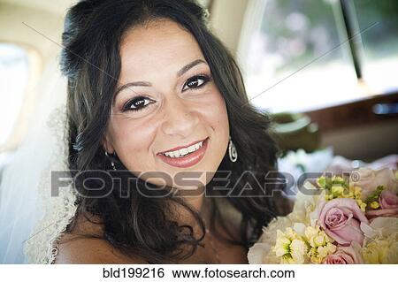 Stock Photograph - Egyptian bride holding bouquet. Fotosearch