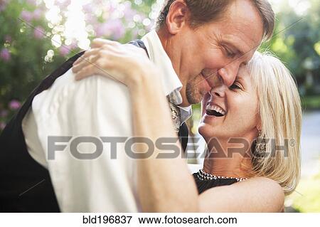 Elegant Caucasian couple hugging View Large Photo Image Stock Photo - Elegant Caucasian couple hugging. Fotosearch