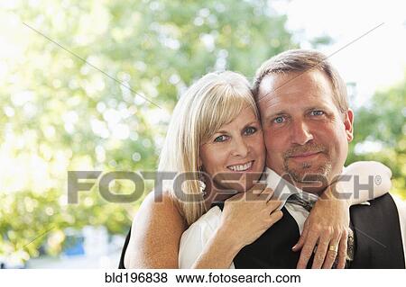 Elegant Caucasian couple hugging View Large Photo Image Stock Photo - Elegant Caucasian couple hugging. Fotosearch