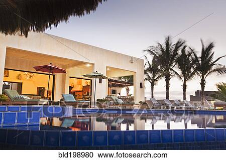 Elegant house and swimming pool View Large Photo Image Stock Image - Elegant house and swimming pool. Fotosearch