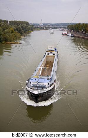 Stock Image - Empty boat on Dutch river. Fotosearch